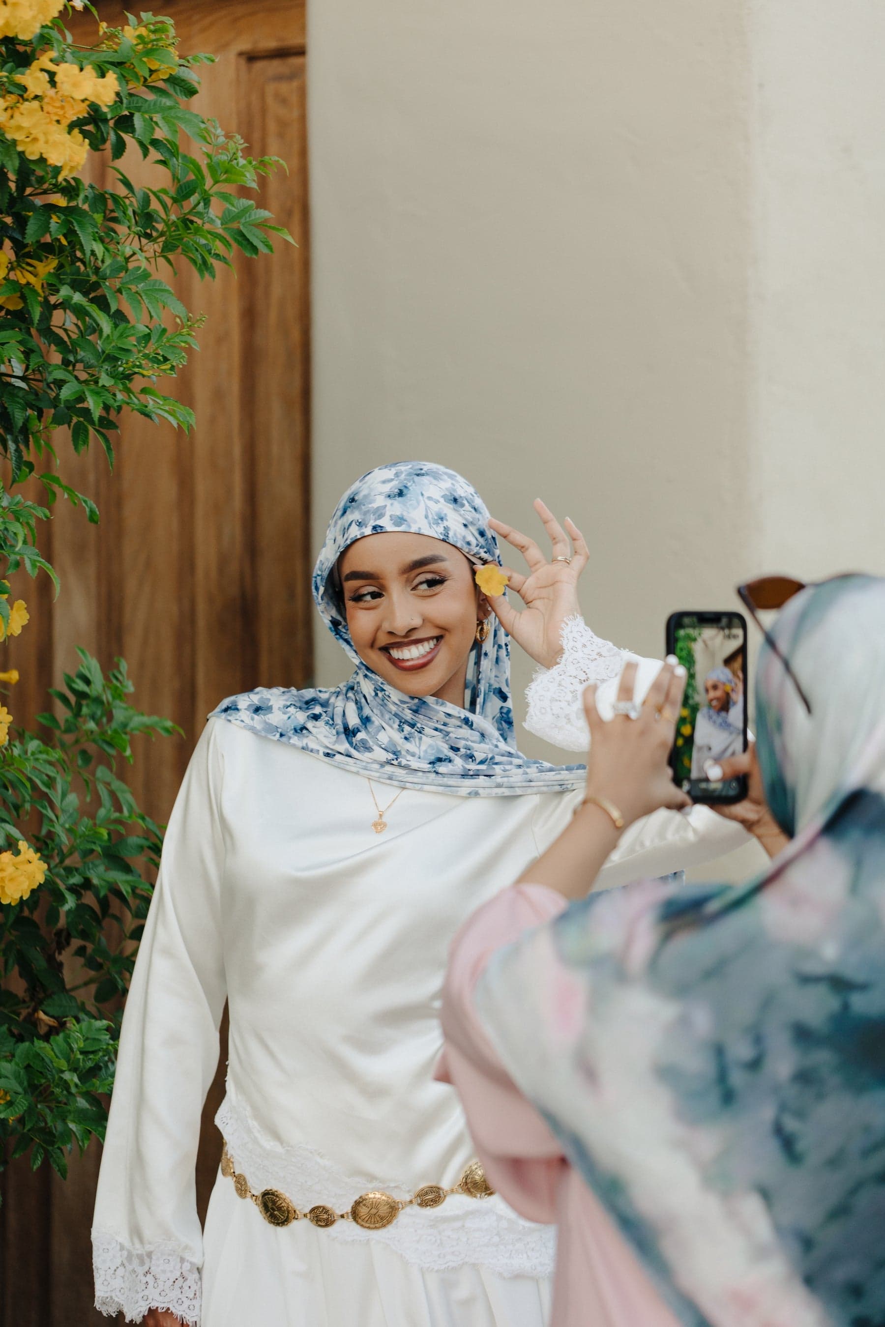 A moment from AYA's campaign, featuring a blue floral hijab